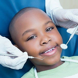 child smiling during his visit to our pediatric dentist in Hurst, TX.