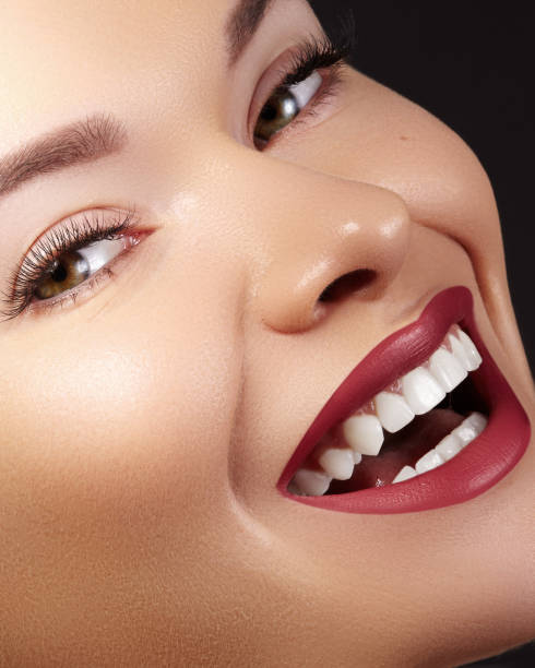 photo of a woman smiling widely showing her radiant teeth