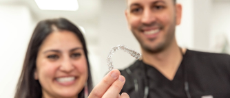 Doctors holding Invisalign Clear Aligners